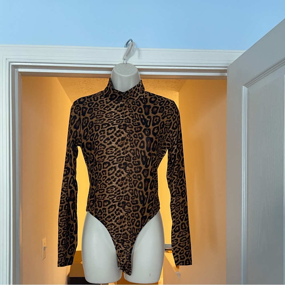 This Fashion Nova bodysuit. Size L
